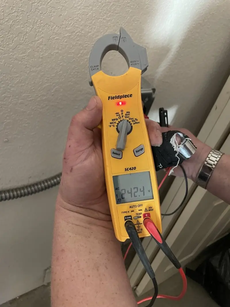Voltage testing with clamp meter during Electrical Installation Services in Bastrop